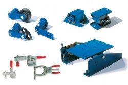 Tensioners and rubber suspension elements
